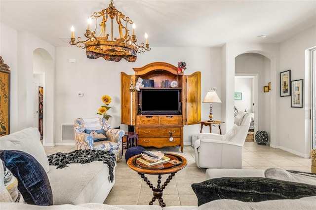 tiled living room with an inviting chandelier