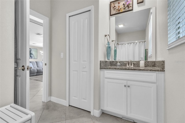 bathroom with vanity and tile patterned flooring