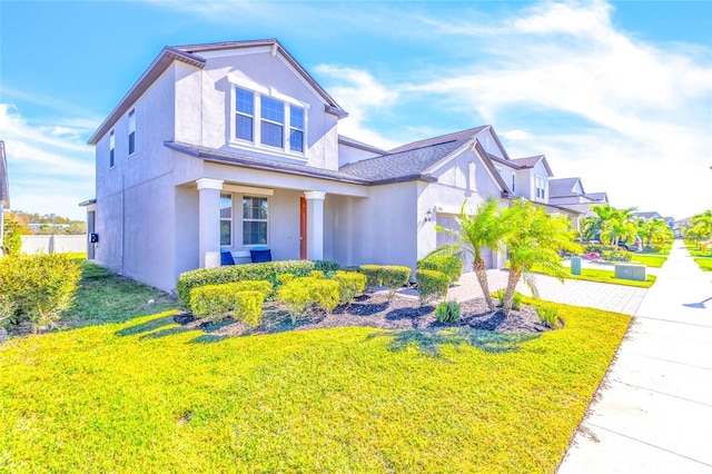 view of front of house with a garage and a front yard