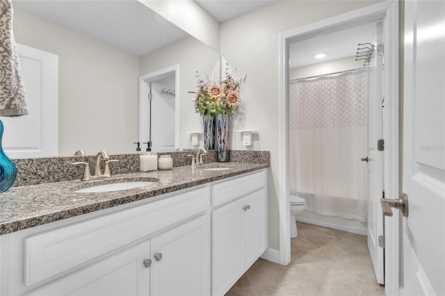 full bathroom with vanity, shower / bath combo, and toilet