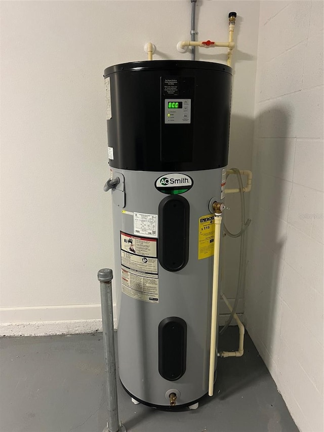 utility room featuring hybrid water heater