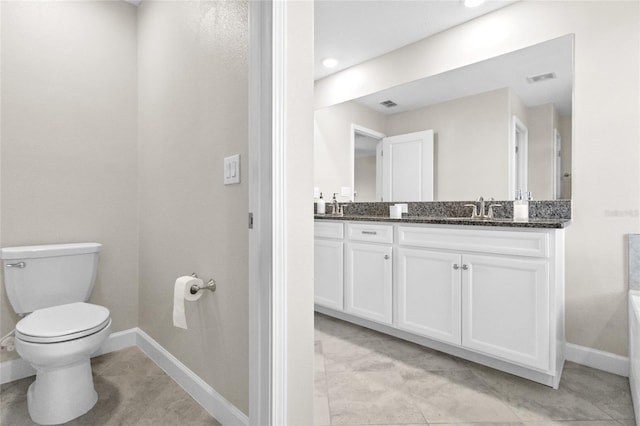 bathroom with vanity and toilet