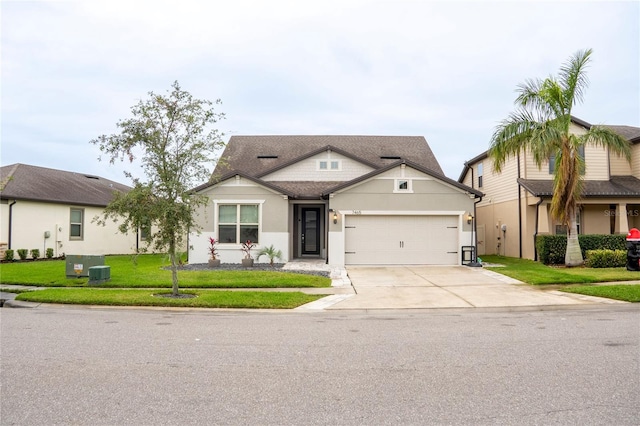 view of front of house with a garage and a front yard