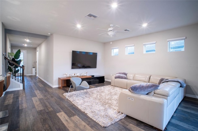 living room featuring dark hardwood / wood-style floors and ceiling fan