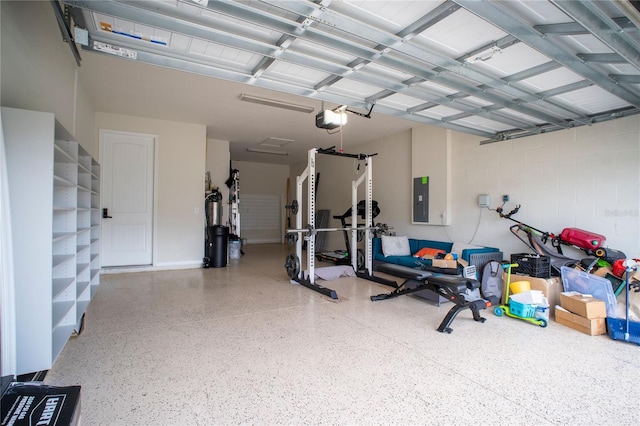 garage with electric panel and a garage door opener