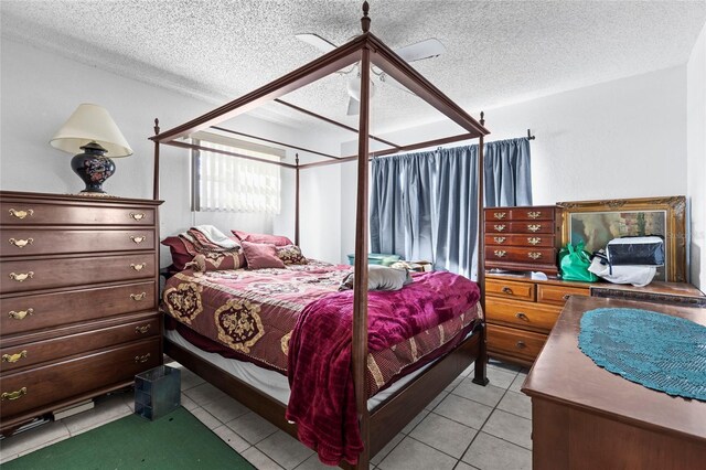 tiled bedroom with a textured ceiling