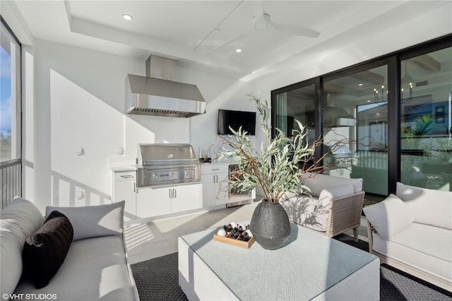 living room featuring ceiling fan and light tile patterned floors