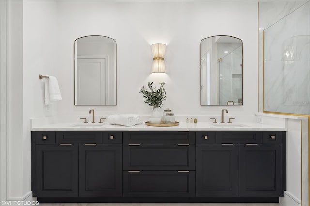 bathroom featuring a shower and vanity