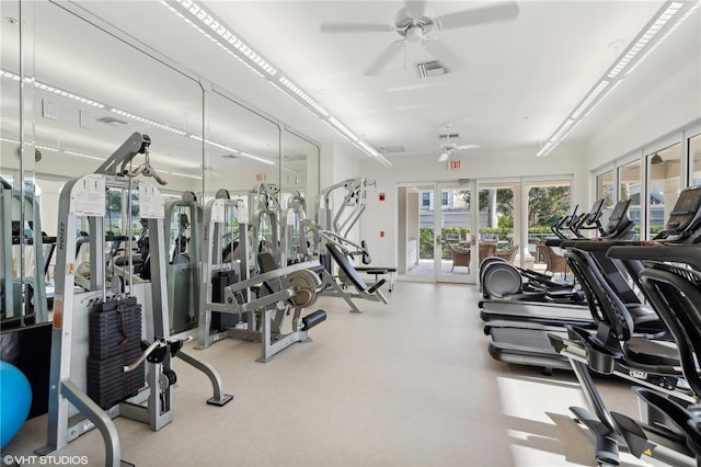 workout area with ceiling fan and french doors