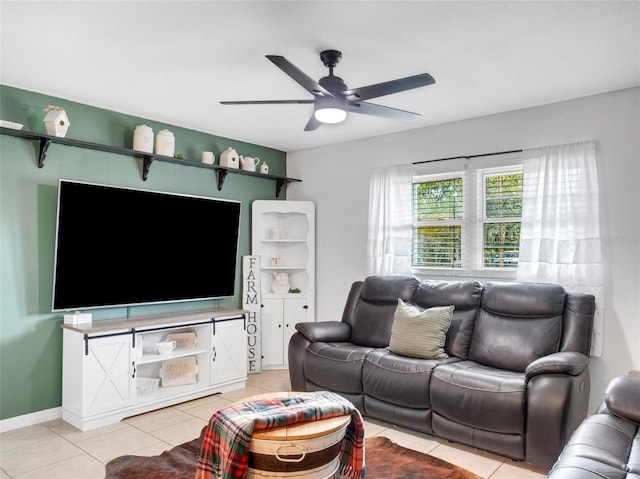 living room with ceiling fan and light tile patterned floors