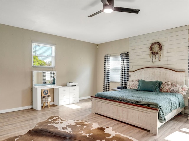 bedroom featuring light hardwood / wood-style flooring and ceiling fan