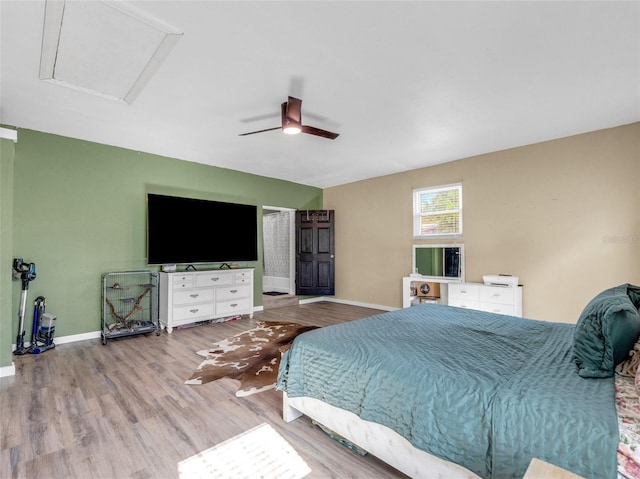 bedroom featuring ceiling fan and light hardwood / wood-style floors