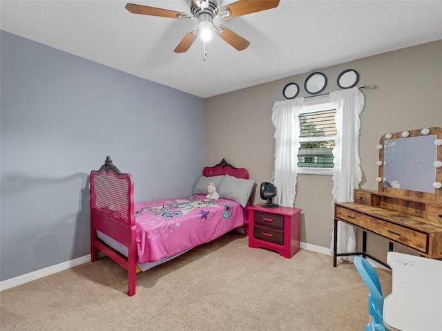 bedroom featuring carpet floors, baseboards, and a ceiling fan