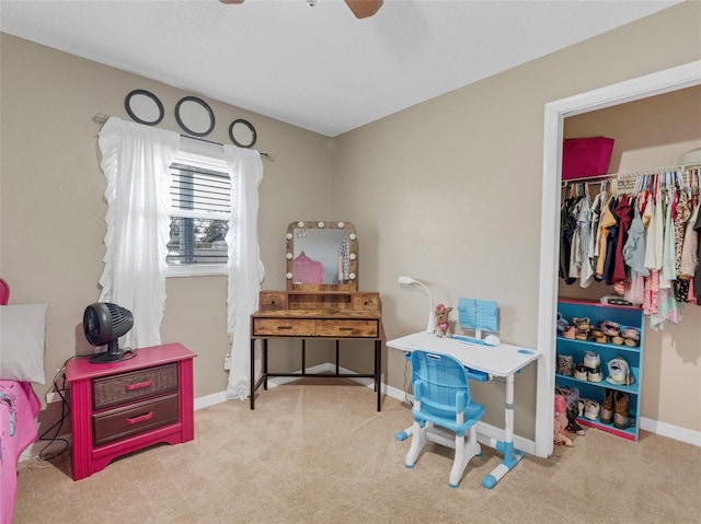 carpeted bedroom with ceiling fan and a closet