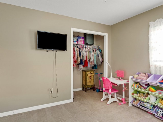 rec room featuring baseboards and carpet flooring