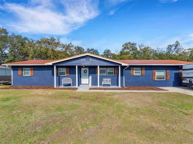 single story home with brick siding and a front yard