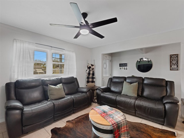 tiled living area with a ceiling fan