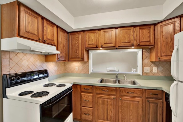 kitchen with backsplash, sink, and white appliances