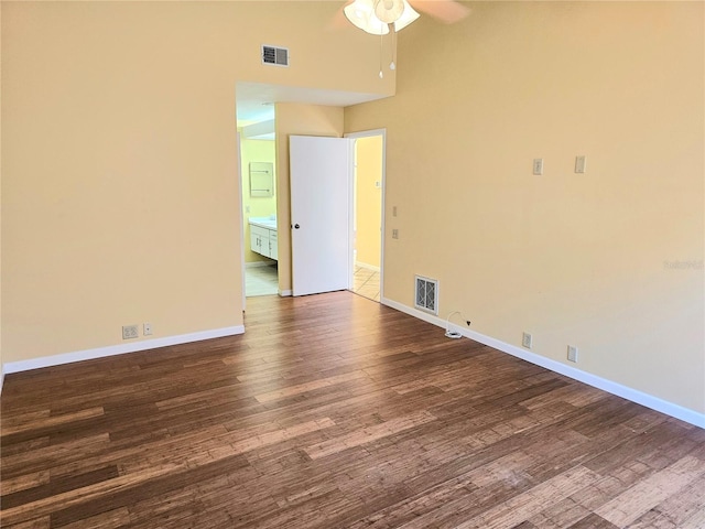 1808 Cypress Trace Dr Unit 1808, Safety Harbor, FL 34695 - empty room with dark wood-type flooring, ceiling fan, and baseboards