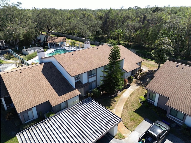 1808 Cypress Trace Dr Unit 1808, Safety Harbor, FL 34695 - drone / aerial view of a pool area and a heavily wooded area