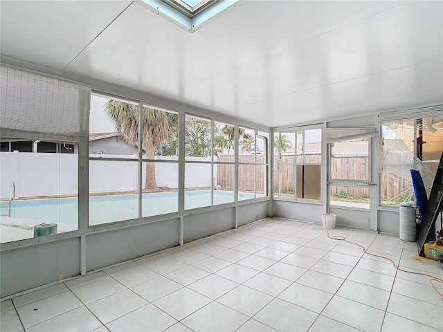 unfurnished sunroom with a skylight and plenty of natural light