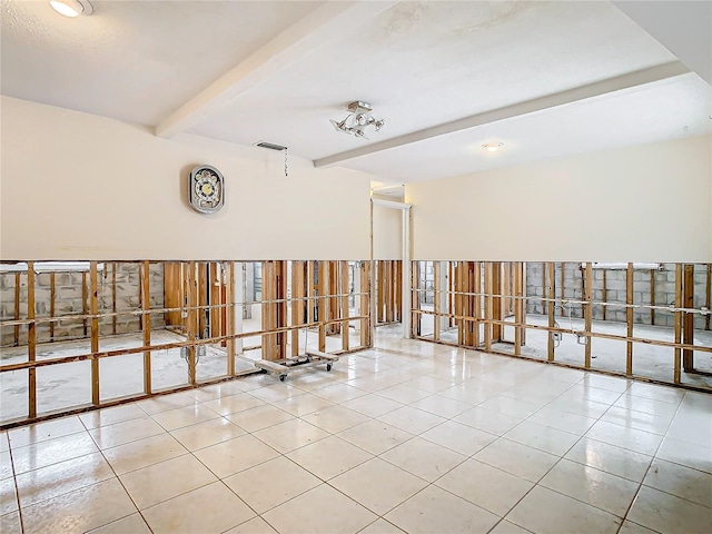 interior space featuring beam ceiling