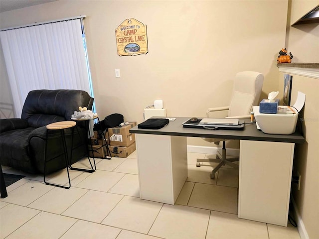 home office with light tile patterned floors