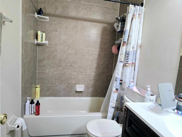 full bathroom with vanity, shower / tub combo, and toilet