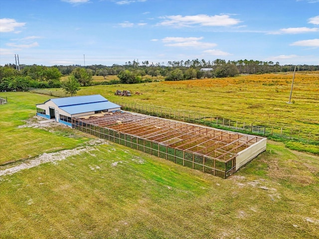 birds eye view of property featuring a rural view