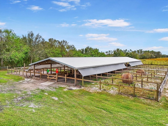 view of stable featuring a rural view