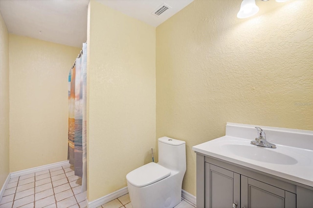 bathroom with tile patterned floors, vanity, toilet, and a shower with curtain