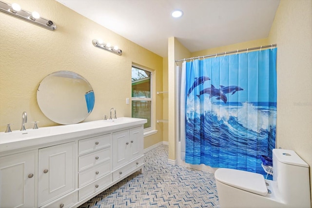 bathroom with a shower with curtain, vanity, and toilet