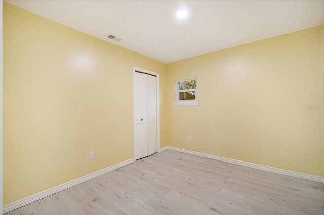 unfurnished room featuring light wood-type flooring