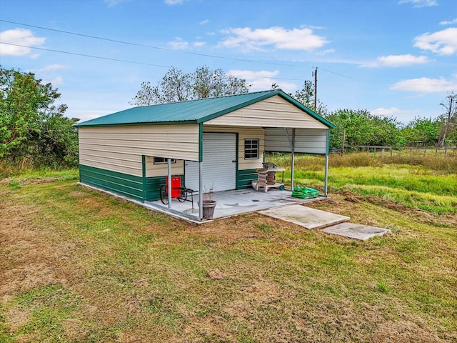 view of outbuilding with a yard