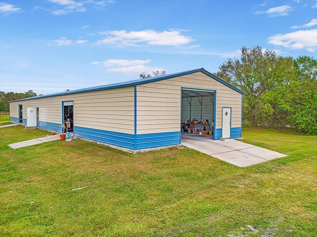 view of outbuilding featuring a yard