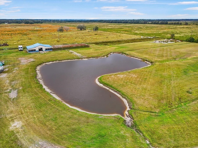 drone / aerial view featuring a water view and a rural view