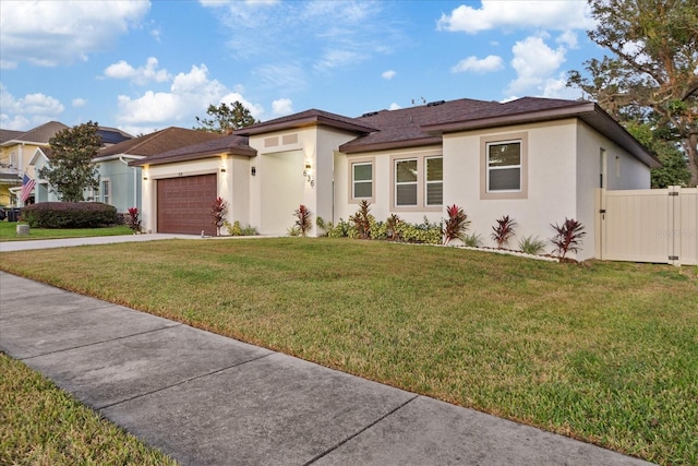 view of front facade featuring a front yard and a garage