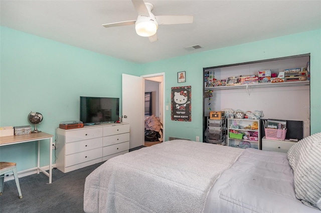 bedroom featuring dark carpet and ceiling fan