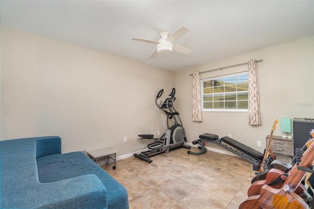 workout area with ceiling fan and light tile patterned floors