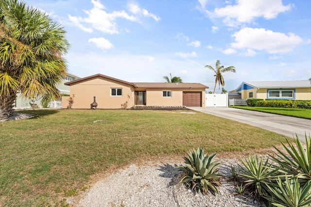 single story home with a front yard and a garage