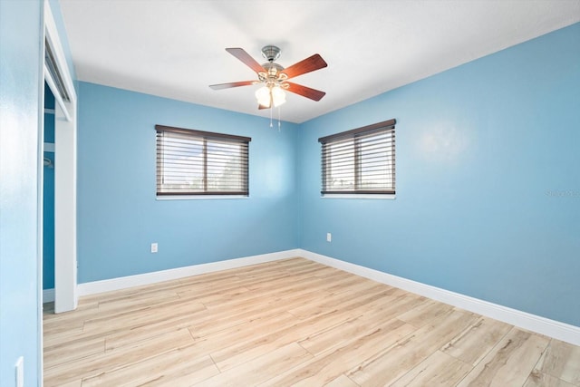 unfurnished room with ceiling fan and light hardwood / wood-style flooring