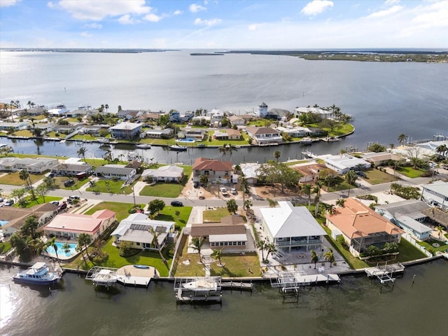 drone / aerial view with a water view