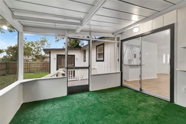 unfurnished sunroom with plenty of natural light