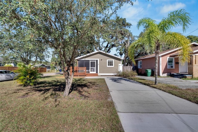 ranch-style home featuring a front yard