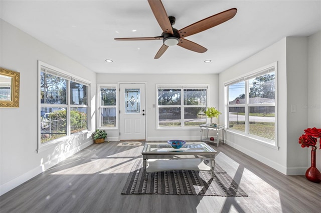 sunroom featuring plenty of natural light and ceiling fan