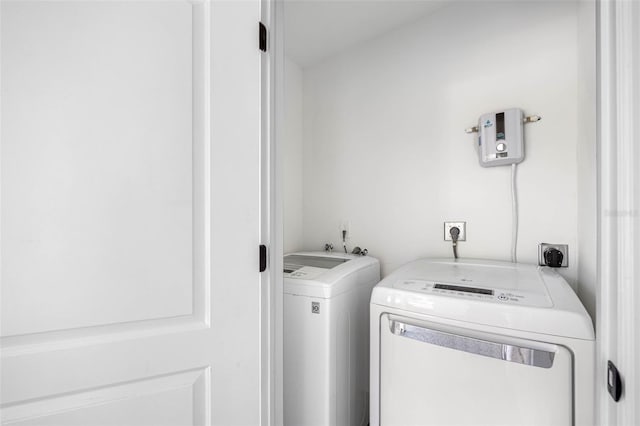 laundry area with independent washer and dryer