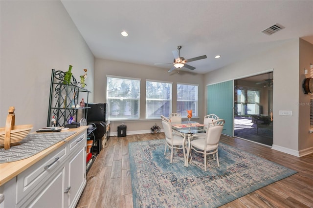 dining room featuring ceiling fan and light wood-type flooring