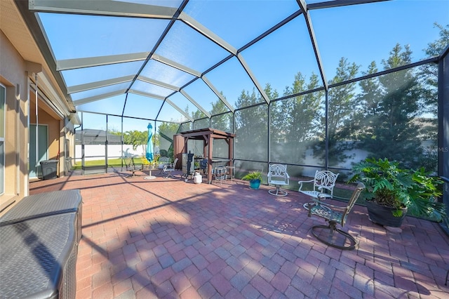 view of patio / terrace featuring a lanai