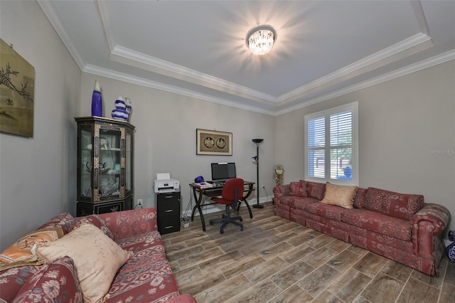 office space with a tray ceiling, ornamental molding, and hardwood / wood-style flooring