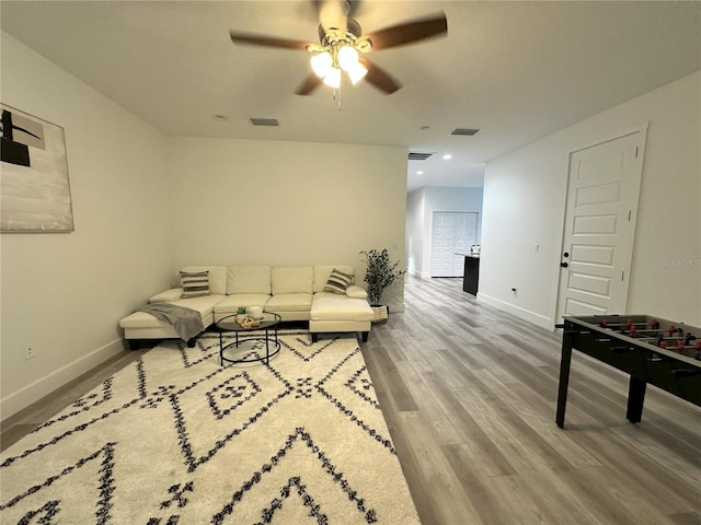 3208 Deleuil Ave, Tampa, FL 33610 - living room with ceiling fan, baseboards, wood finished floors, and recessed lighting